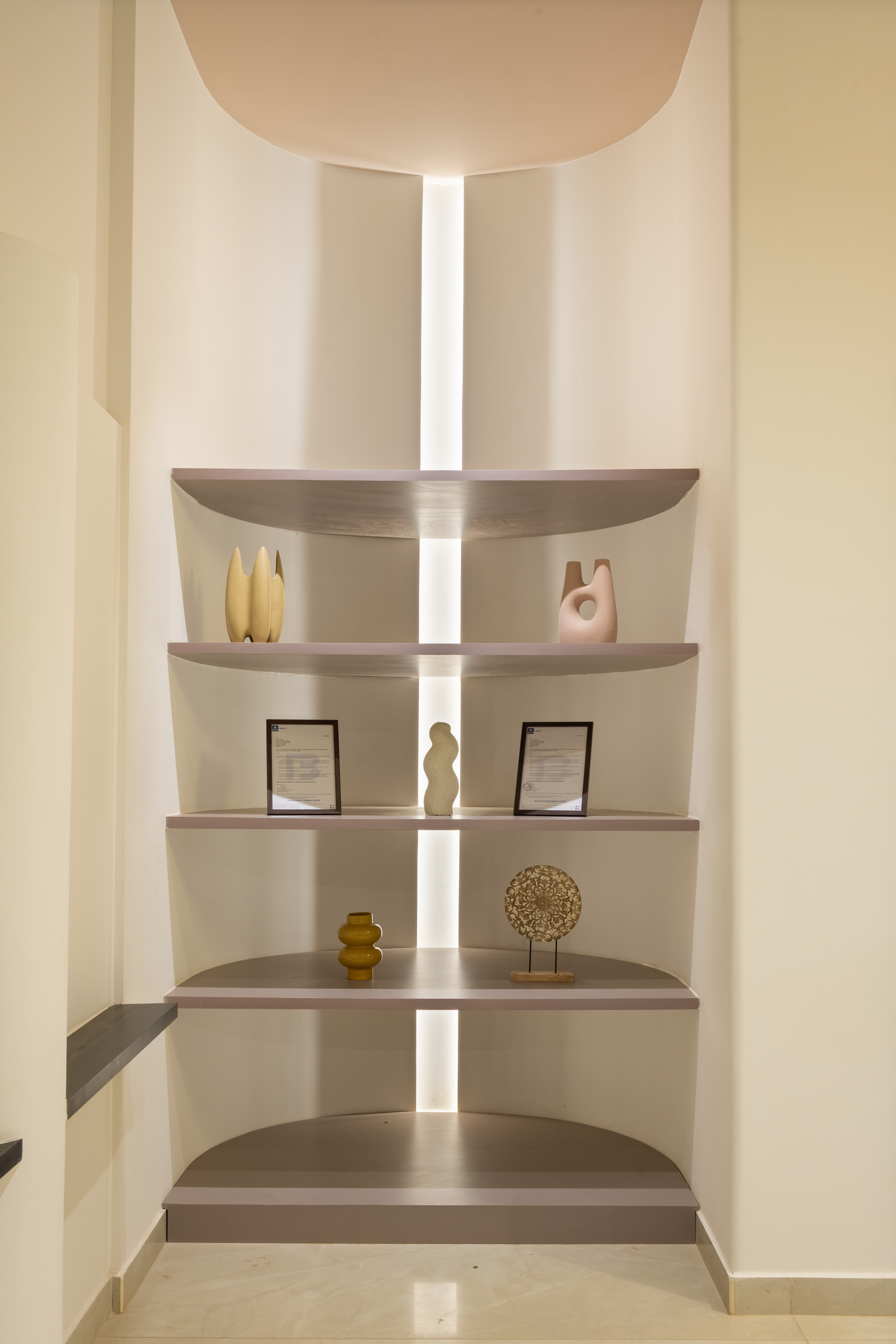 Lit display niche with curated objects