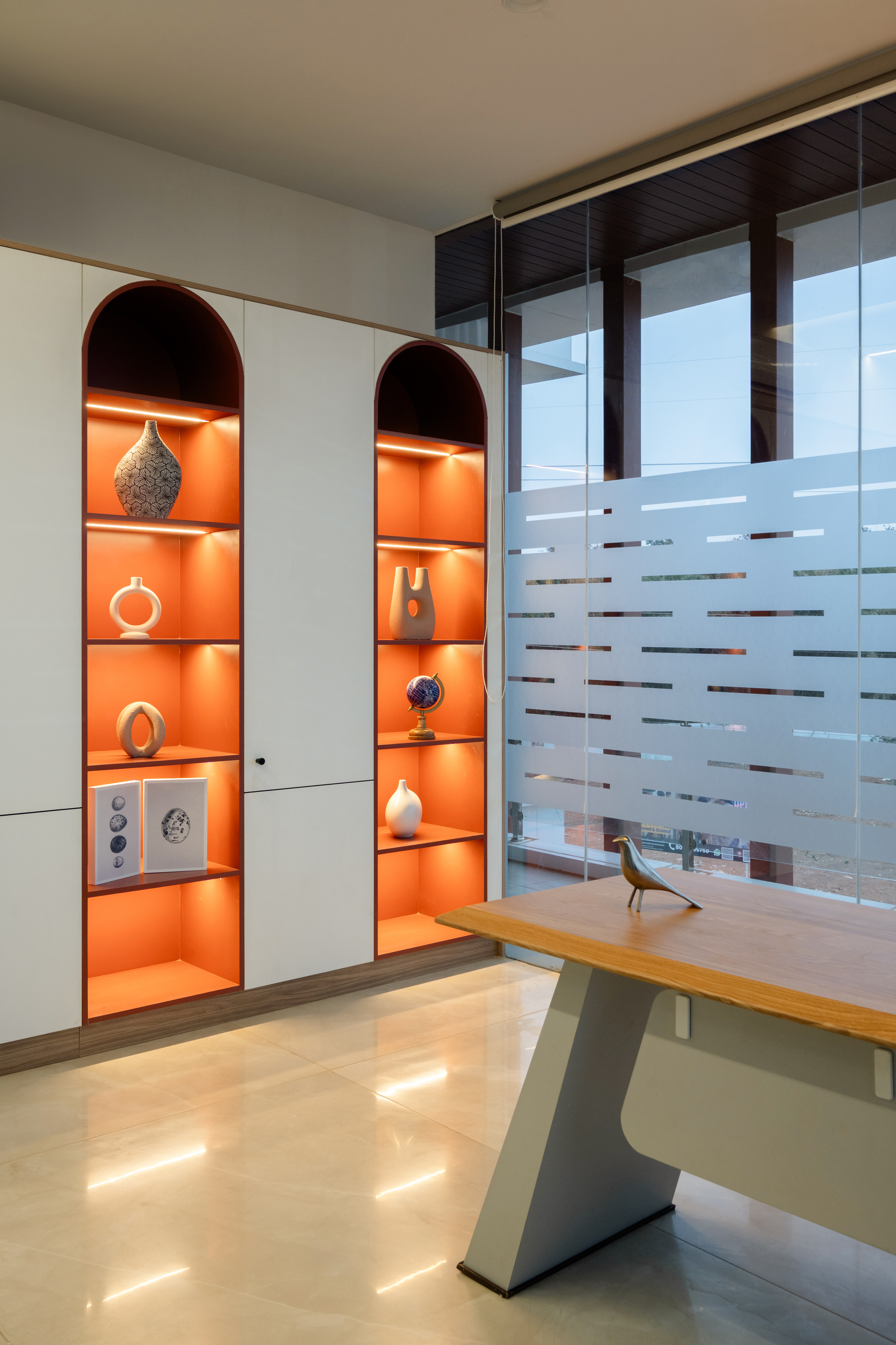 Meeting room with warm timber shelving